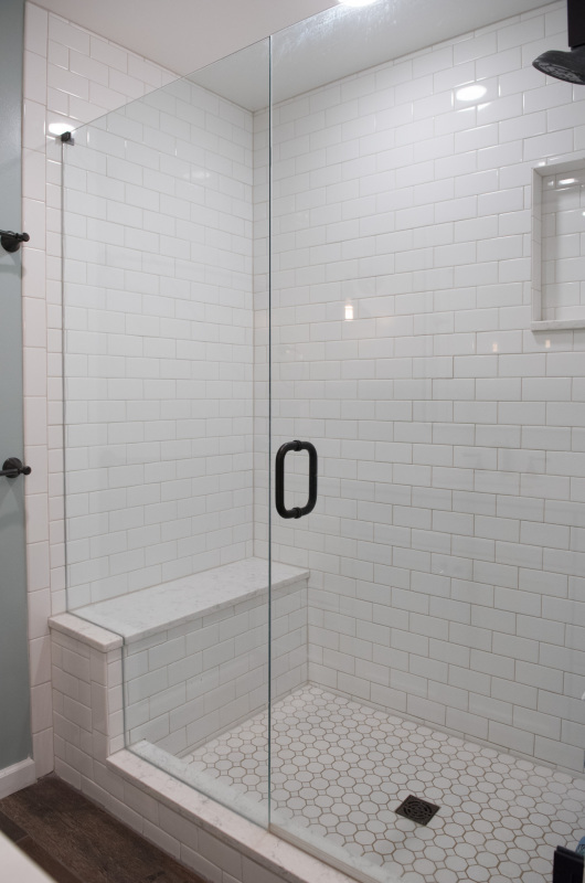 shower with white tile